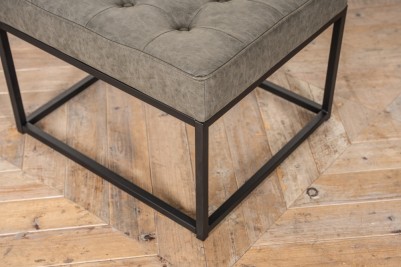 stone green footstool with metal frame